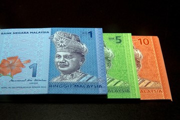 Malaysia Currency (MYR): Stack of Ringgit Malaysia bank note. There are one, five and ten Ringgit Malaysia