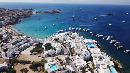 Naklejka premium Aerial drone photo of famous turquoise clear water beach of Psarou in iconic island of Mykonos, Cyclades, Greece