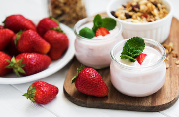 healthy breakfast, yogurt, fresh strawberries and granola