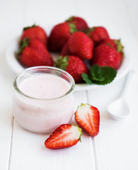 Jar with strawberry yogurt