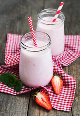 Jars with strawberry yogurt