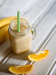 A banana orange smoothie. Healthy milkshake