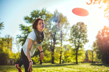 Woman throwing flying disk
