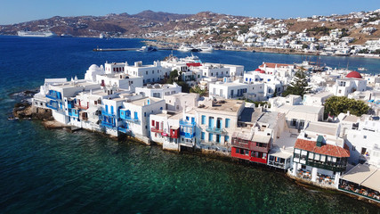 Fototapeta na wymiar Aerial view of iconic colourful little Venice in old town of Mykonos island at sunset, Cyclades, Aegean, Greece