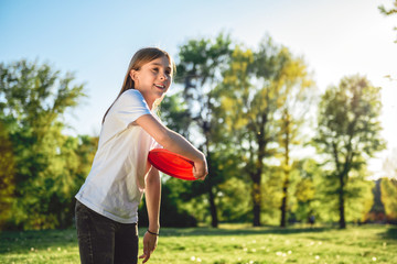 Girl throwing Frisbee