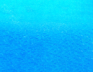Gradient Blue water abstract background, Close up swimming pool rippled texture.