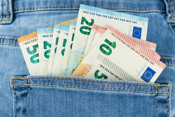 Euro banknotes in a pocket of a jeans