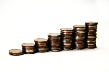 stacks of iron coins in ascending order, isolate on white background