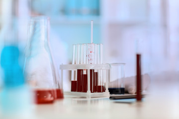 Test tubes with samples of blood on table in laboratory