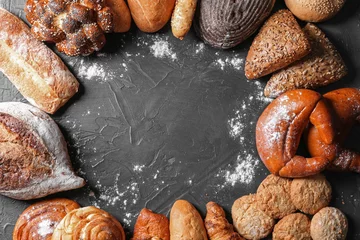 Gordijnen Different bakery products on gray background © Pixel-Shot
