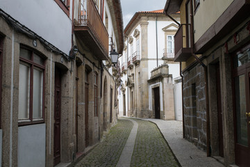 Fototapeta na wymiar Empty historic streets of the Old Quarter in Guimaraes, Portugal