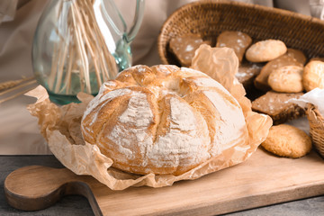 Freshly baked bread on wooden board. Bakery food