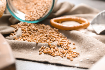Scattered wheat grains on cloth. Baking ingredient