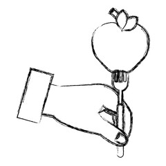 hand with apple in fork