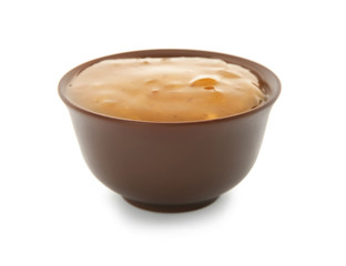 Tasty sauce with herbs in bowl on white background