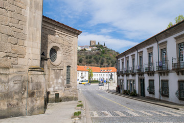 Fototapeta na wymiar View through the streets of Lamego towards the hilltop Lamego Castle, Portugal