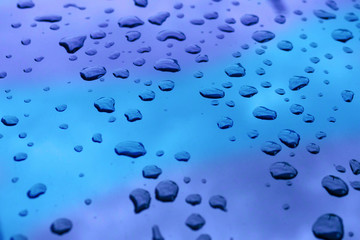 Drops of water on blue background.
