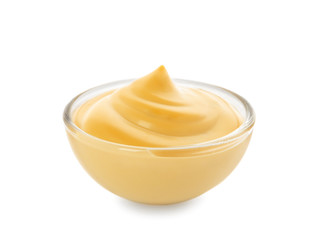 Bowl with tasty sauce on white background