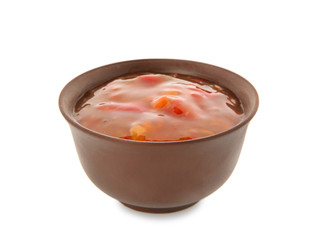 Bowl with red sauce on white background