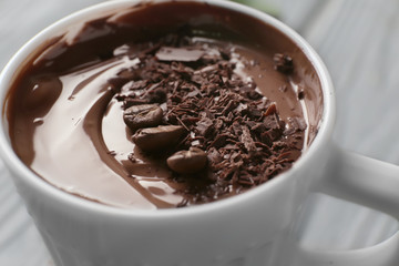 Cup with molten chocolate, closeup
