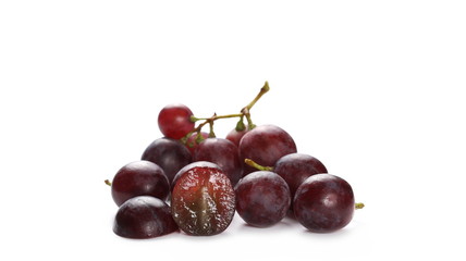 Cardinal grapes with halved slice isolated on white background