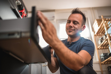 Men building kitchen cabinet