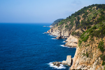 Fototapeta na wymiar beautiful view of rocky cliff and blue sea in Spain