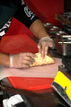 Real kitchen of fast food restaurant and the chef who cooking a doner kebab