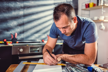 Man building kitchen cabinets