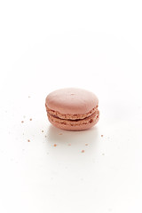 single strawberry macaroon in a white table