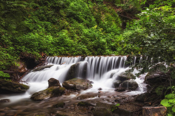 Fototapeta na wymiar Waterfall in a mountainous area. Threshold. Ukraine. Waterfall Shipot