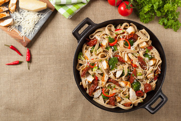 Whole-grain tagliatelle pasta with grilled chicken.