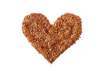 Sign  heart lined with flax seeds. Concept- healthy diet, cancer prevention, vegetarianism, raw food diet.
