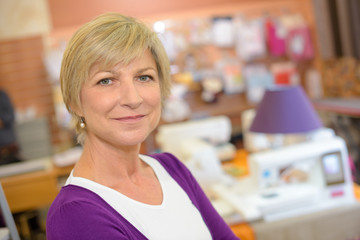 portrait of woman with home decoration store in background