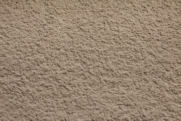 Dirty brown painted stucco wall. Background texture