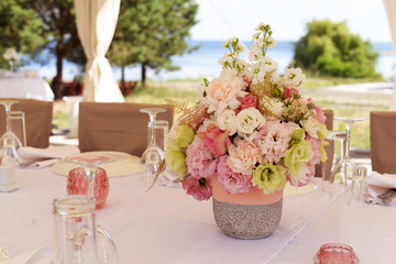beautiful wedding bouquet with white flowers with roses and golden leaves