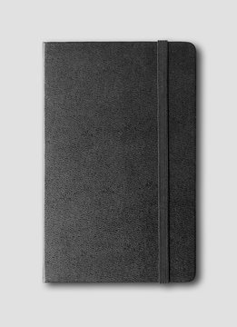 black closed notebook isolated on grey