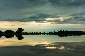 Dark clouds reflecting in the water of the lake