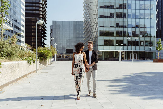 Cheerful Couple Walking On Street