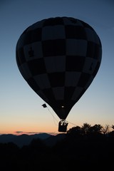 Hot air balloon against the evening sky at sunset