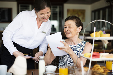 Woman ordering from a menu