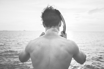 Caucasian man preparing for snorkeling