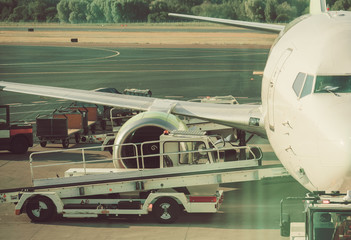 Commercial passenger plane in the airport. Aircraft maintenance.