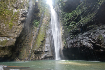 Waterfall in green rainforest. Triple waterfall Sekumpul in the mountain jungle. Bali,Indonesia. Travel concept.