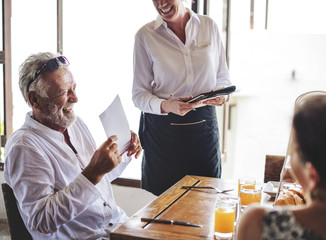 Friends having breakfast at a hotel