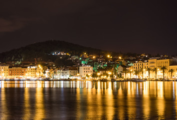 Fototapeta na wymiar Beautiful view on the old town and Marjan park in Split, Croatia at night.