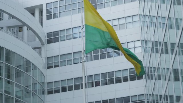 Close shot of the flag of The Hague at the city hall. Shot in sixty frames per second variable frame rate.