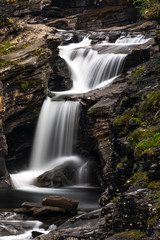 Beautiful cascade streaming in nature in Lyngenfjord, Norway.