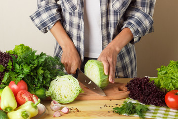 Woman cooks at the kitchen