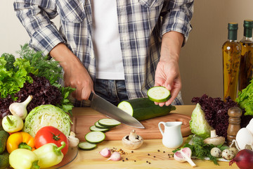 Woman cooks at the kitchen